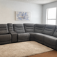 Kelsee Pleather Power-Reclining Sectional